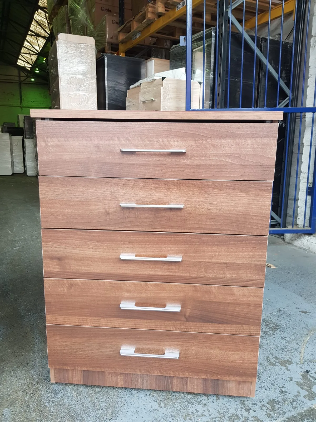 Three-door wardrobe with drawer storage